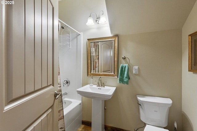 full bathroom with bathing tub / shower combination and toilet