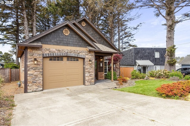 view of front facade with stone siding, driveway, and a garage