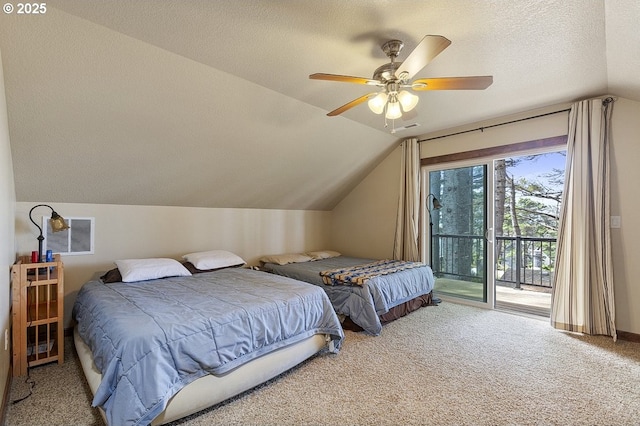 carpeted bedroom featuring access to exterior, vaulted ceiling, a textured ceiling, and ceiling fan