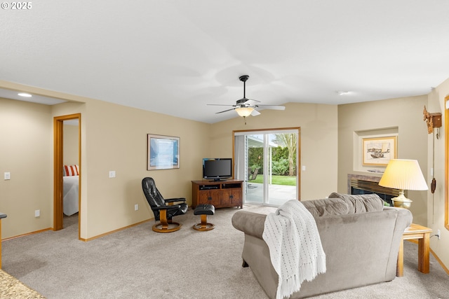 carpeted living room featuring ceiling fan