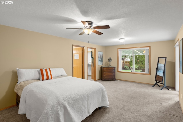 carpeted bedroom with ceiling fan and a textured ceiling