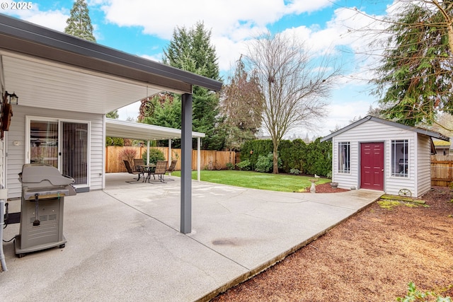 view of patio / terrace featuring an outbuilding and a grill