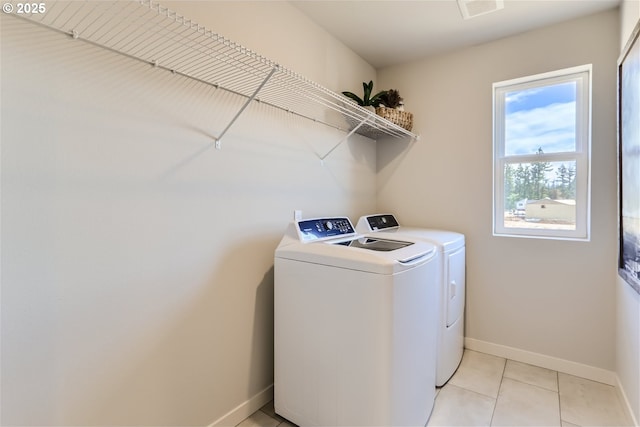 5990 Henshaw St SE, Albany, OR 97322 - laundry room featuring washer and dryer and light tile patterned floors