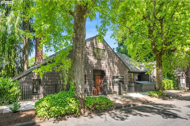 2687 NW Cornell Rd, Portland, OR 97210 - view of front of home with a fenced front yard and a chimney