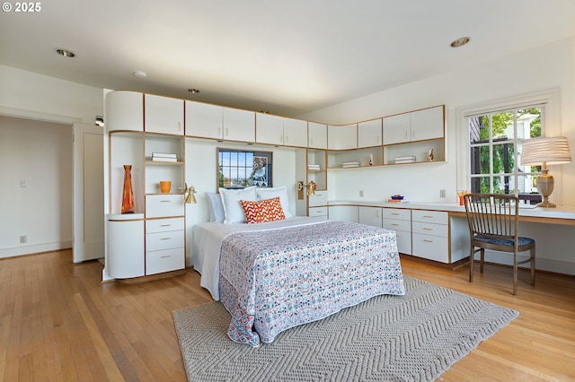 2687 NW Cornell Rd, Portland, OR 97210 - bedroom featuring light wood finished floors and built in desk