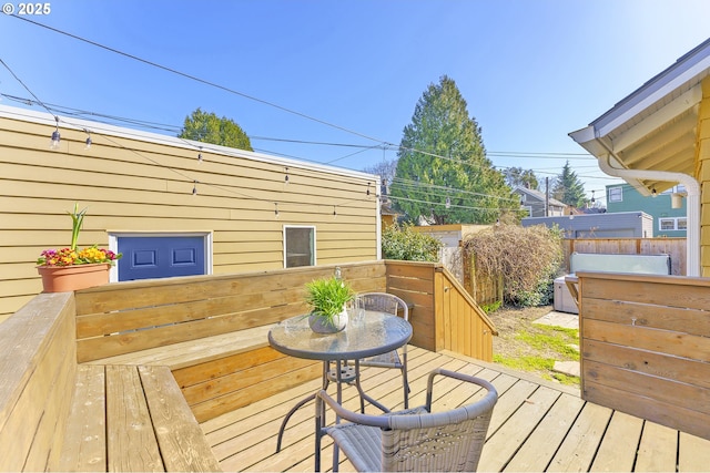 wooden terrace featuring fence