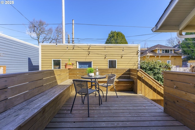 wooden deck with outdoor dining space