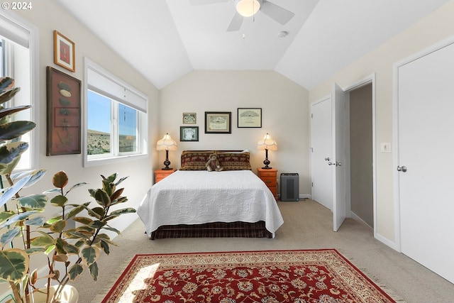 bedroom featuring lofted ceiling, ceiling fan, carpet, and baseboards