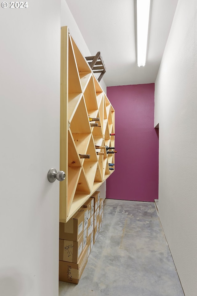 wine cellar featuring concrete floors