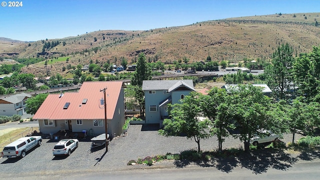birds eye view of property featuring a mountain view