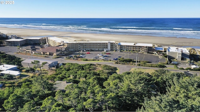 aerial view featuring a water view and a beach view