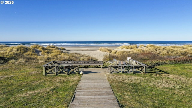 exterior space featuring a view of the beach and a water view