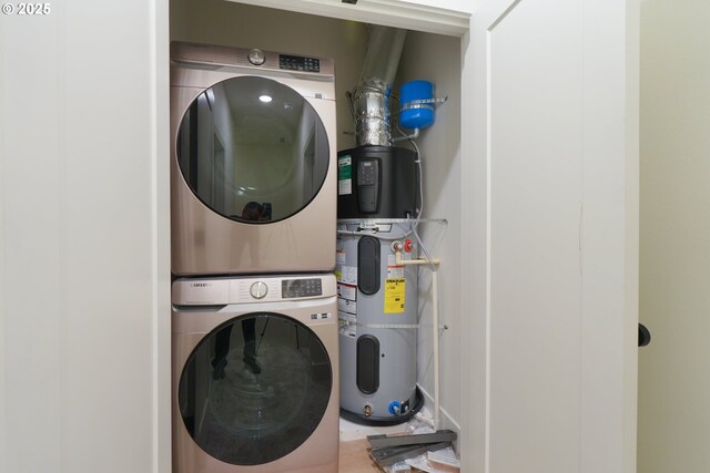 2389 SE 135th Ave Unit 11, Portland, OR 97233 - laundry area with stacked washer / drying machine and heat pump water heater