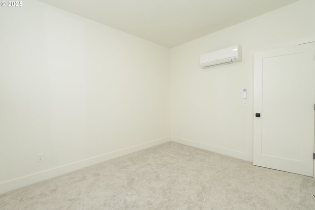 2389 SE 135th Ave Unit 11, Portland, OR 97233 - carpeted spare room featuring a wall mounted AC and baseboards