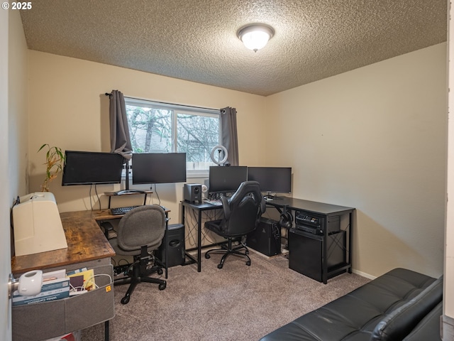 carpeted home office with a textured ceiling