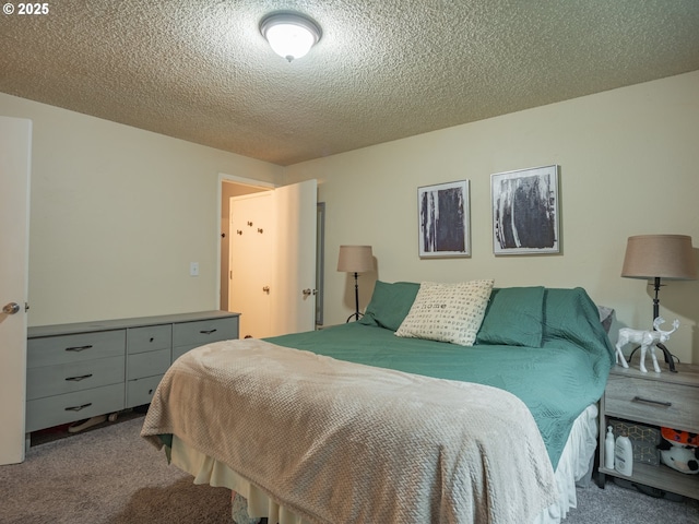 bedroom with carpet flooring and a textured ceiling