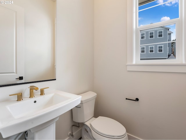 bathroom featuring sink and toilet