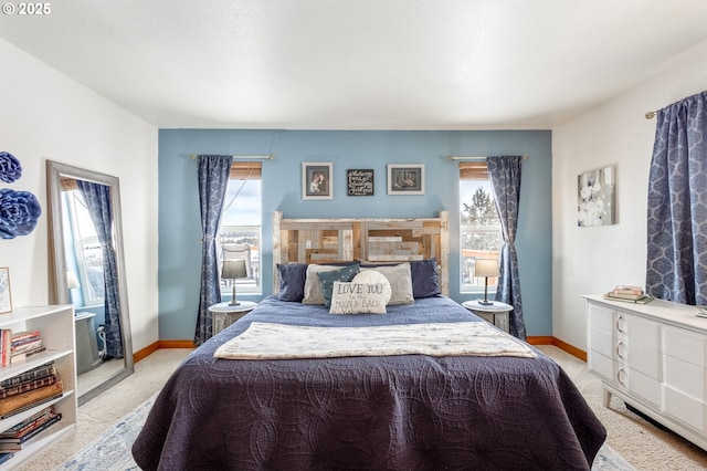 bedroom featuring light carpet