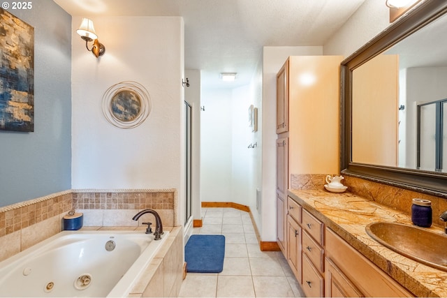 bathroom with independent shower and bath, vanity, and tile patterned floors