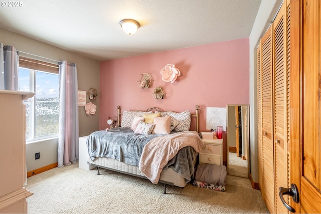 carpeted bedroom featuring a closet