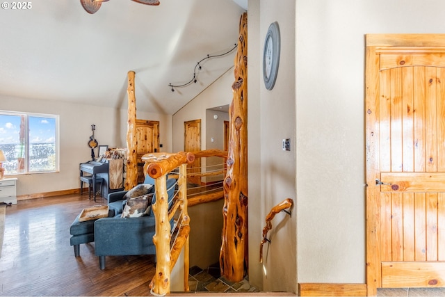 sitting room with hardwood / wood-style flooring, ceiling fan, and lofted ceiling