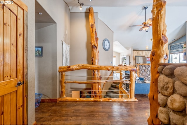 hall featuring lofted ceiling and dark hardwood / wood-style flooring