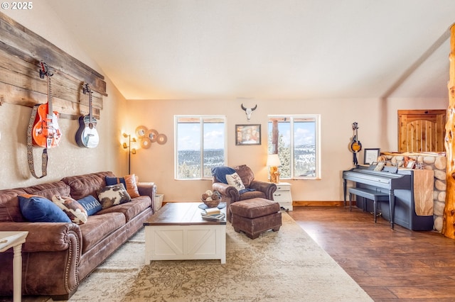 living room featuring vaulted ceiling and hardwood / wood-style floors