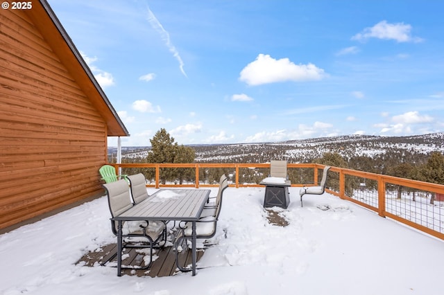 view of snow covered deck