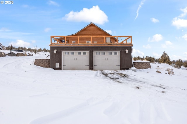 view of snow covered garage