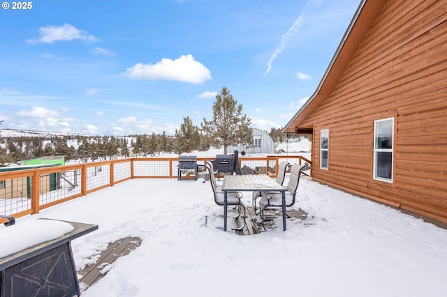 view of snow covered deck