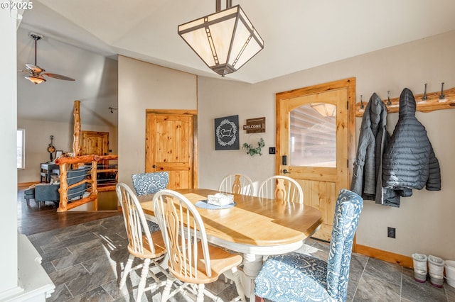 dining space with vaulted ceiling and ceiling fan