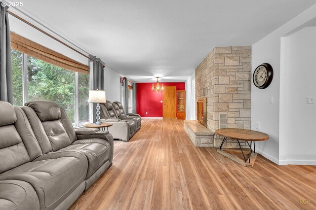 61241 Perry Creek Rd, Saint Helens, OR 97051 - living area with light wood-style floors, baseboards, and a chandelier