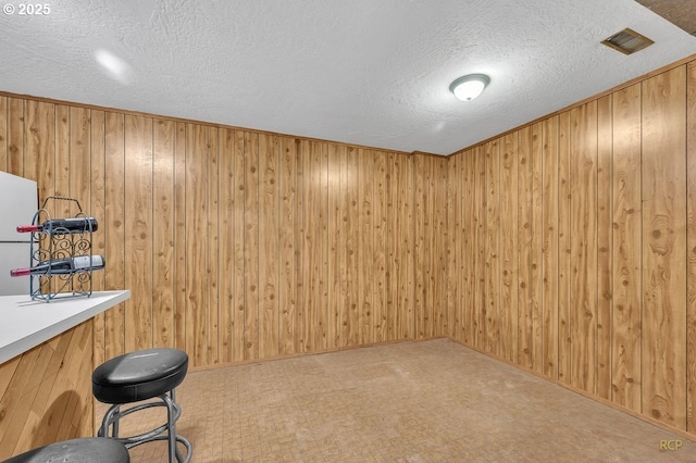 61241 Perry Creek Rd, Saint Helens, OR 97051 - interior space featuring a textured ceiling and wood walls