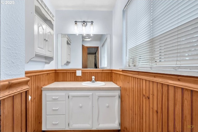 61241 Perry Creek Rd, Saint Helens, OR 97051 - bathroom with wainscoting, wood walls, and vanity