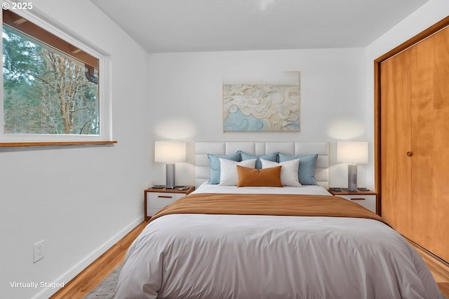 61241 Perry Creek Rd, Saint Helens, OR 97051 - bedroom with baseboards and wood finished floors