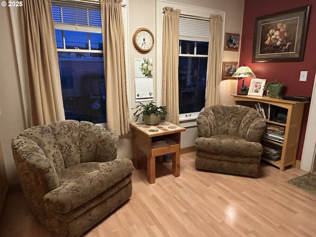 living area with light hardwood / wood-style flooring