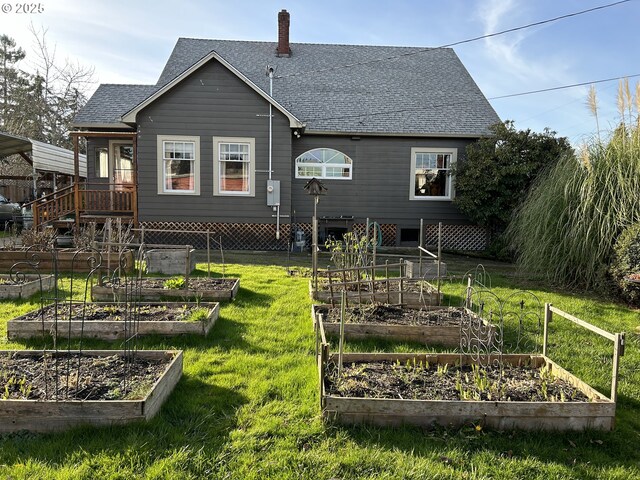 back of house with a yard