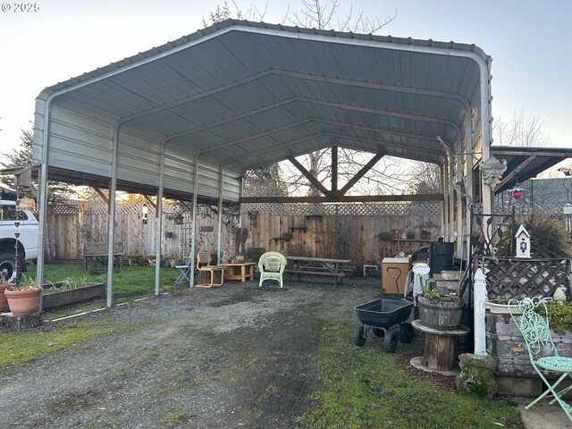 view of parking / parking lot featuring a carport