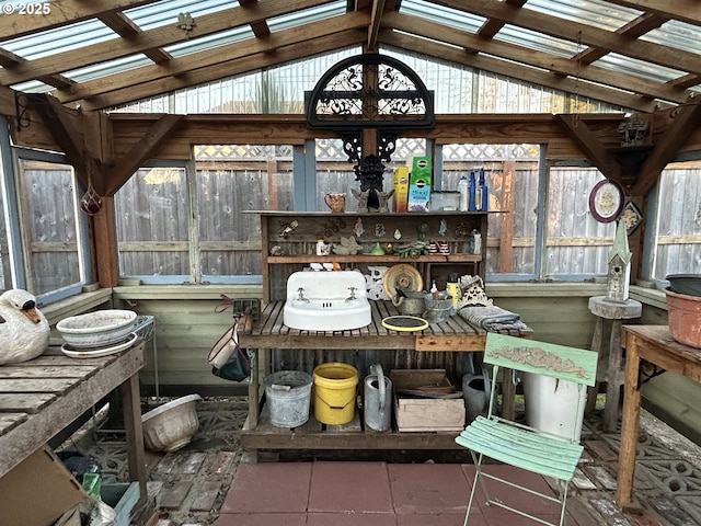 sunroom featuring lofted ceiling