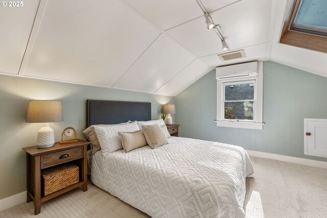 bedroom featuring track lighting, baseboards, vaulted ceiling, and light colored carpet