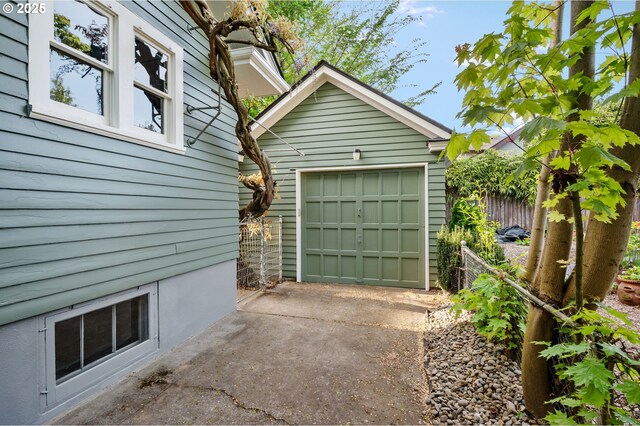 detached garage with concrete driveway
