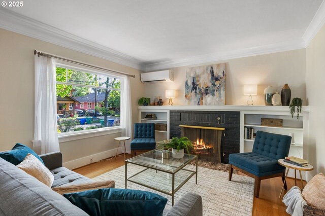 living room featuring crown molding, wood finished floors, a fireplace, and a wall mounted air conditioner