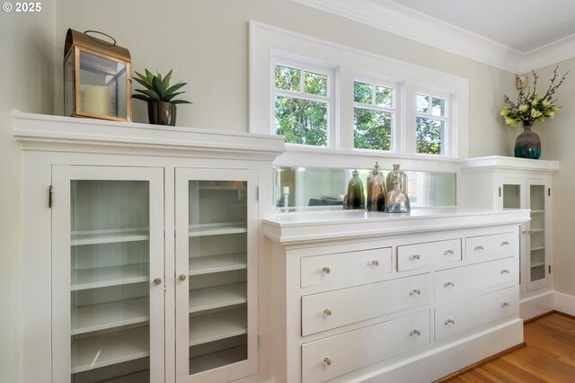 details with crown molding and wood finished floors