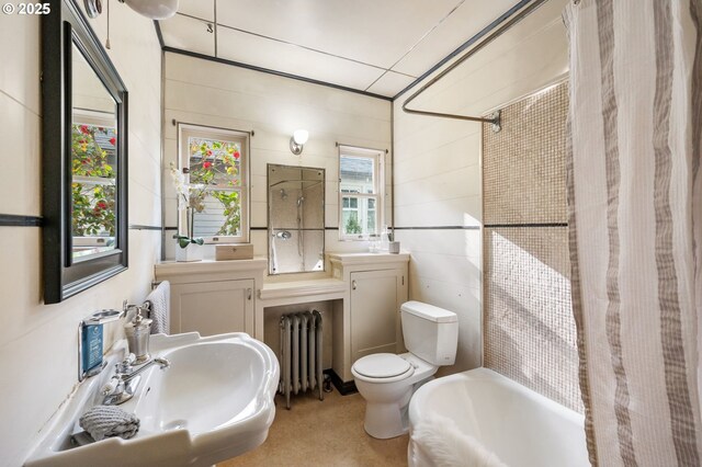 full bathroom with a sink, radiator, shower / bathtub combination with curtain, and toilet