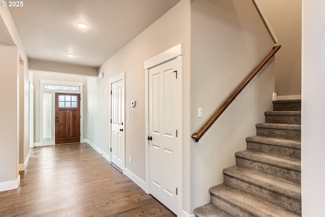 foyer entrance featuring hardwood / wood-style flooring