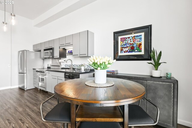 12600 SW Crescent St, Beaverton, OR 97005 - dining room featuring dark wood-type flooring and baseboards