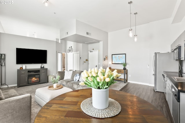 12600 SW Crescent St, Beaverton, OR 97005 - living room with baseboards, dark wood-style floors, and a glass covered fireplace