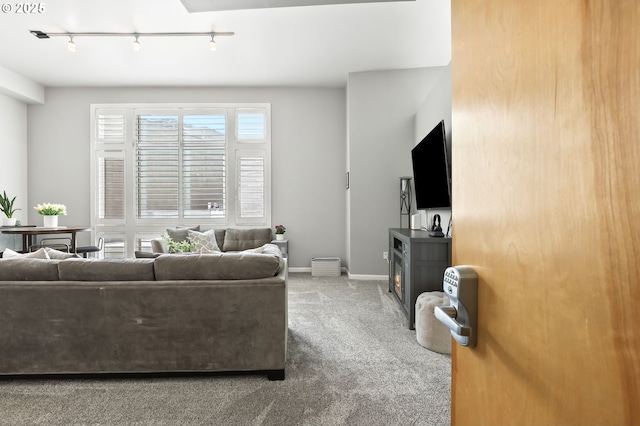 12600 SW Crescent St, Beaverton, OR 97005 - carpeted living area with rail lighting and baseboards