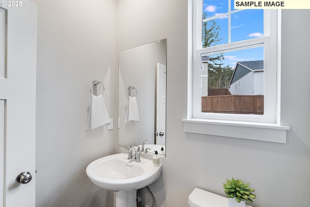 12176 SW Champlin Ln, Beaverton, OR 97007 - half bathroom featuring a sink and toilet