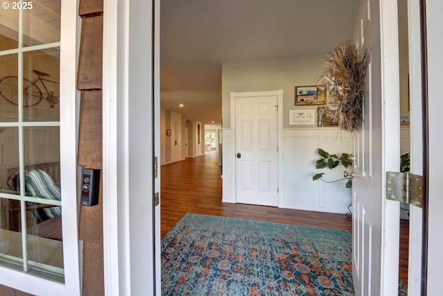 corridor with wood-type flooring